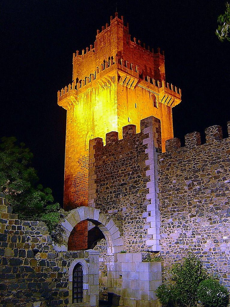 The lighted tower of Castle of Beja at night.