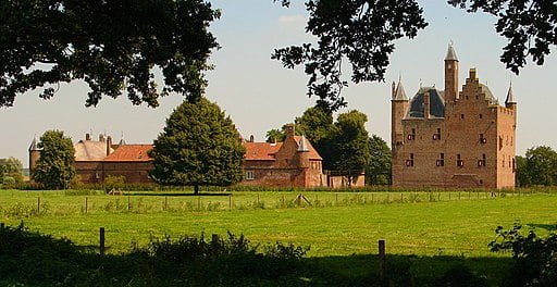 Doornenburg Castle standing tall across the fields.