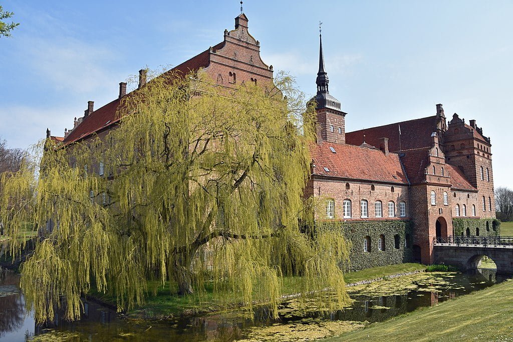 Holckenhavn Castle surrounded by water.