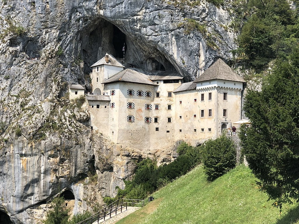 The amazing Predjama castle standing near the mountain limestone.