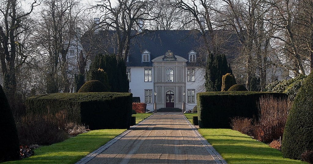 The view of Schackenborg Castle from the entrance. 