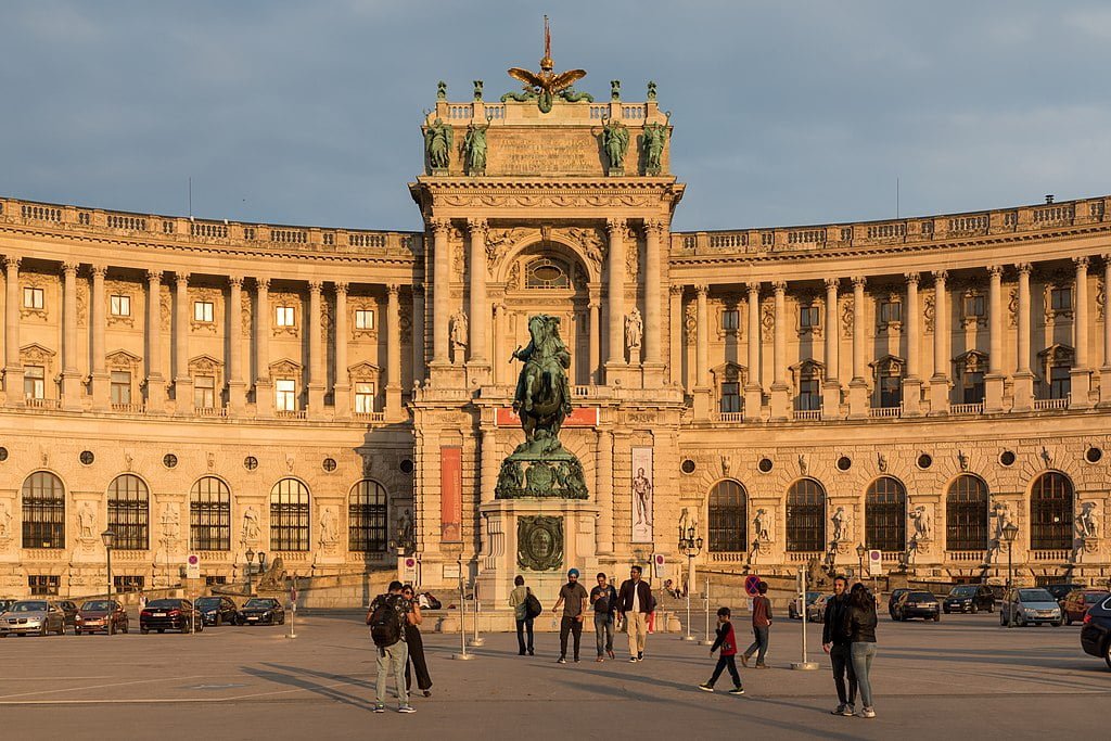 The front of Hofburg with visitors around.