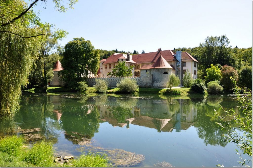 Otocec Castle's view from across the water.