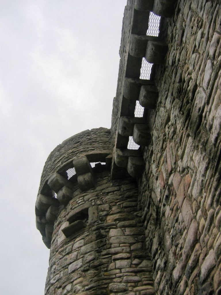 Looking up at the machicolations of Craigmillar Castle in Scotland