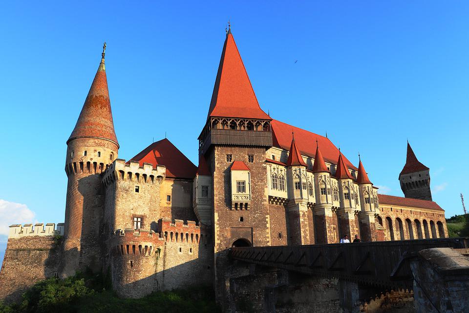 Corvin Castle with its conical roofs and spires.