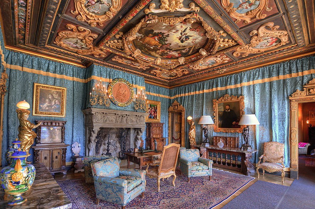 The Dodge’s Sitting Room in Hearst Castle. Original antiques and imported Persian carpets are highlights, while the ceiling imitates a Medici palace.