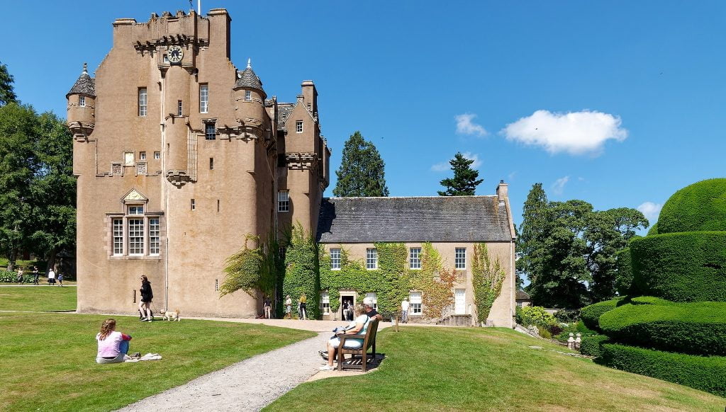 Visiting tourists around Craigievar Castle.