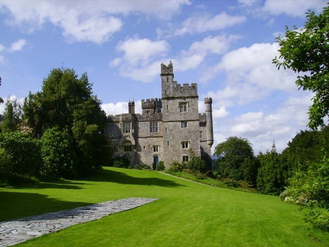 The magnificent stone castle and its lush green gardens