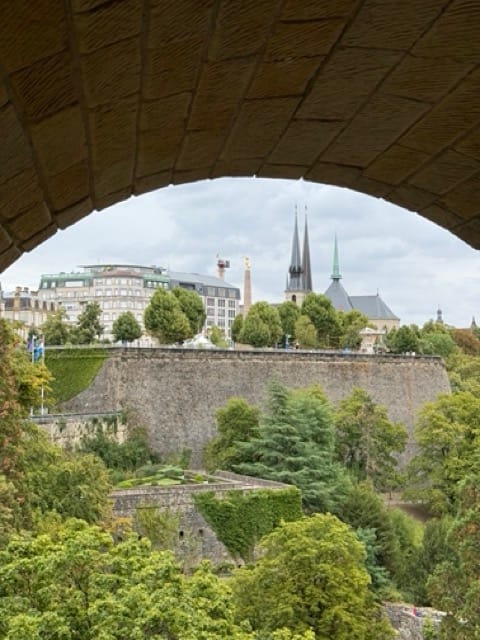 View through Adolphe Bridge arch toward Luxembourg City