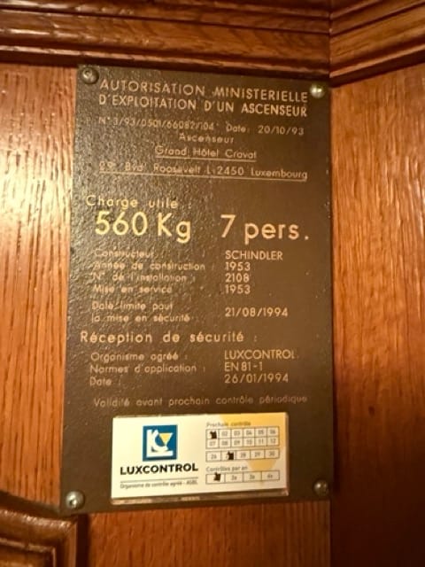 Historic elevator information plate at Grand Hôtel Cravat
